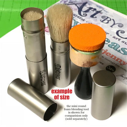 Tim Holtz Distress Blending Brush ... Pack of 2 shown with a Mini Distress Foam Blending Tool - Distress Blending Brush ... by Tim Holtz. Natural bristle brush with retractable silver coloured casing and lid. 2 (two) brushes.  Tim's fantastic retractable blending brush brings together a traditional stencil brush and the shape and versatility of a makeup brush. The bristles feel softer with the rounded shape, giving you the flexibility for distressing and blending styles.