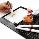 example of using the Tim Holtz Glass Media Mat Travel Size for Left Handed People plus Protective Pouch