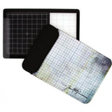  the Tim Holtz Travel Sized Glass Media Mat with a protective sleeve pouch by Tonic Studio