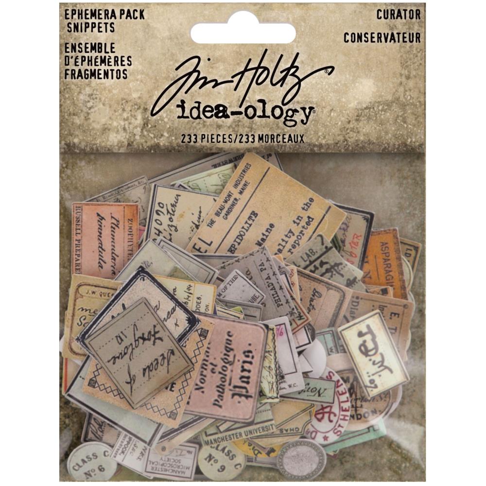 Curator - Snippets Ephemera ... Die Cut Embellishments and Layers - by Tim Holtz Idea-Ology. Over 230 little pieces of labels and vintage imagery printed on fine paper, precut and ready to use in visual arts and papercrafts. Use for junk journals, tags, embellishing envelopes, mixed media, card making, assemblage projects, using as labels for tiny bottles, decorating seasonal display makes, layering in collage. Pack of 233 little tiny die cut paper pieces. Sizes and designs vary up to an inch wide. TH94152