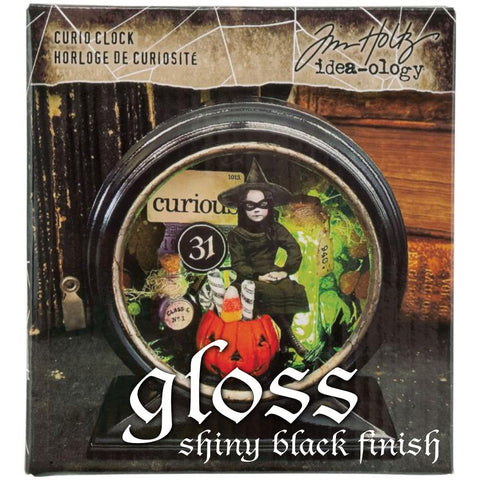 Curio Clock Frame, Gloss Black ... by Tim Holtz Idea-Ology - Use for mixed media, assemblage projects, off-the-page marvels and party decor. 1 (one) open fronted, metal round frame with rectangle base and silver surround on the front. The frame is black inside and out, with a glossy shiny finish.  Create your own unique miniature home, garden, scene or other amazing display piece using this black metal clock shaped frame.  Example of use on the packaging.