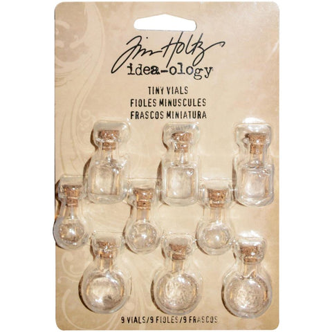 Tiny Glass Vials with Corks ... by Tim Holtz Idea-Ology - Use for mixed media, assemblage projects, off-the-page marvels and party decor. Pack of 9 (nine) little glass bottles with cork lids, approx 1" (25mm) high. Three different shaped jars (3 of each).