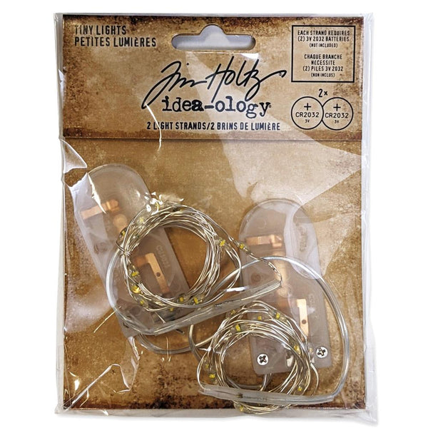 Tiny Lights, Clear ... by Tim Holtz Idea-Ology - Use for cardmaking, mixed media, assemblage projects, off-the-page marvels and party decor. Pack of 2 (two) strands of tiny fairy lights with clear bulbs. Batteries not included.