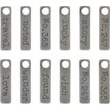 Story Sticks, Metal Adornments by Tim Holtz Idea-Ology  displaying words and numbers on short rectangular pendants