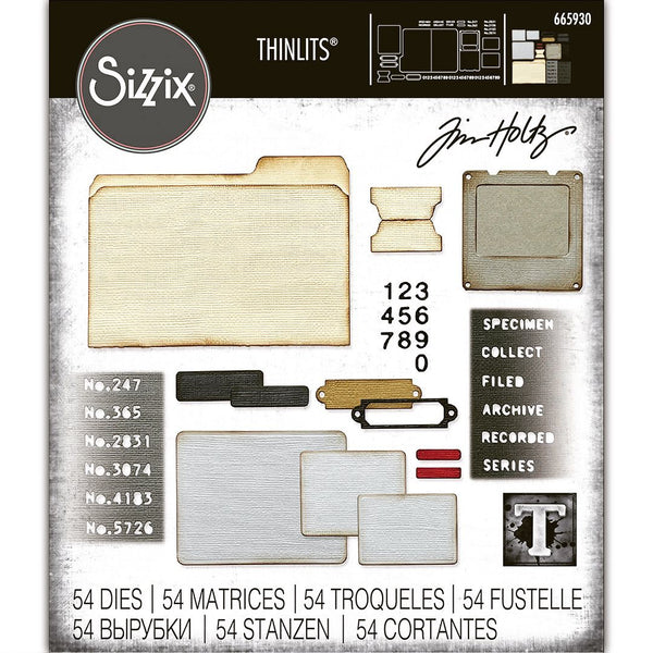 Specimen - Sizzix Thinlits die cutting templates by Tim Holtz. 54 (fifty four) assorted labels, tags, tickets, numerals, slide frame and a file folder (no.665930). 