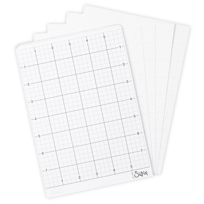 overview of Medium Sticky Grid Sheets - by Sizzix. Pack of 5 (five) pieces, each 6" x 8 1/2" (15.5cm x 22cm). Double sided low tack, temporary adhesive sheets. Reusable, versatile and long lasting.  Sizzix Sticky Grid Sheets are a double sided sheet with low tack temporary adhesive on each side. They are designed to hold die cutting templates like Thinlits and Framelits firmly in place, enabling you to cut out the same shape or word multiple times without the dies shifting while in use. 