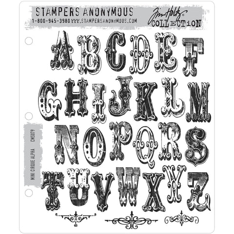 Cirque Alpha (alphabet) Mini ... 29 (twenty nine) rubber stamps by Tim Holtz (CMS079). Letters are approx 1 1/2" high. Set includes 3 (three) decorative scrolls.  This wonderful set of stamps includes all 26 letters of the alphabet and 3 intricate scroll dividers. The illuminated uppercase letters are designed using a style of lettering often used for circuses and carnivals many years ago. 