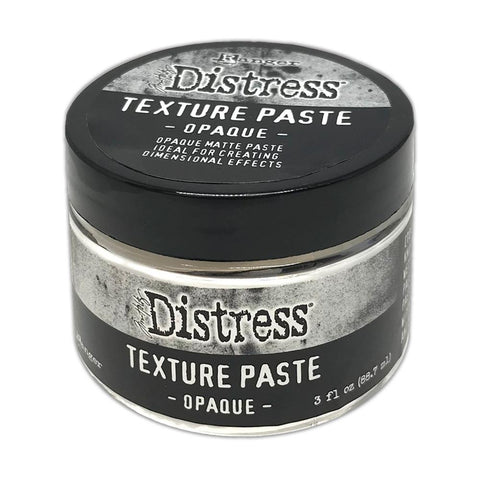 Texture Paste, Opaque - Tim Holtz Distress Dimensional Medium with solid white coverage and matte finish, 3fl oz (88.7ml) jar. Made by Ranger.  This Tim Holtz Distress Texture Paste has a dimensional medium dries as you place it, with all the marks, peaks and effects you create. It is smooth white medium which dries to an opaque (white) matte finish that is flexible and can be stained, die cut, trimmed or altered.