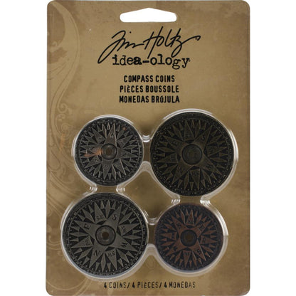 Compass Coins Idea-Ology by Tim Holtz - metal embellishments featuring the design of a compass with polished finish and predrilled centre hole. 4 (four) compasses, one of each. 
Designed by Tim Holtz, this set of metal compass pieces add a special element to cardmaking, memory keeping as well as journaling, collage, visual arts and mixed media. Made in 3 vintage colours of Antique Nickel, Brass and Copper.