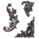 Tim Holtz Idea-Ology Adornments Metal Moulded 3D dimensional Flourish Embellishments for Visual Arts, image showing example of the design. Actual pieces are shiny clean silver in colour.