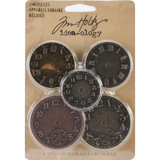 TimePieces Metal Idea-Ology Adornments by Tim Holtz - 5 (five) round metal coins with a polished finish, featuring clock faces with numbers and Roman numerals. Designed by Tim Holtz, this set of metal embellishments add a special element to cardmaking, memory keeping as well as journaling, collage, visual arts and mixed media. Inspired by all things vintage, the colours are Antique Nickel, Brass and& Copper. TH92831
