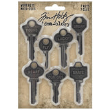 Word Keys, Metal Adornments ... by Tim Holtz Idea-Ology - Realistic metal silver coloured keys with words engraved. Use for mixed media, assemblage projects, off-the-page marvels and party decor. 7 (seven) pieces, 1 (one) of each design.   The wonderful vintage styling of these Metal Adornment Word Keys are a vintage silver colour, designed by Tim Holtz to enhance your project with a thoughtful word on a uniquely shaped piece - words are : found, fly, lucky, dream, heart, curious, brave.