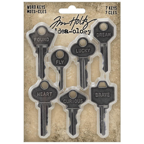 Word Keys, Metal Adornments ... by Tim Holtz Idea-Ology - Realistic metal silver coloured keys with words engraved. Use for mixed media, assemblage projects, off-the-page marvels and party decor. 7 (seven) pieces, 1 (one) of each design.   The wonderful vintage styling of these Metal Adornment Word Keys are a vintage silver colour, designed by Tim Holtz to enhance your project with a thoughtful word on a uniquely shaped piece - words are : found, fly, lucky, dream, heart, curious, brave.