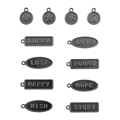 Word Tags ... Idea-Ology Metal Adornments by Tim Holtz ... variety of symbols and words on little metal tags to use as embellishments for decorations, mixed media, cardmaking, papercraft, scrapbooking and visual arts. 12 (twelve) charms and labels (one of each design). TH04330. Photo of all the designs.