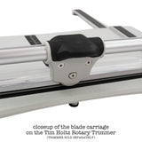 closeup of the Replacement Blade with Carriage (for the Tim Holtz Rotary Media Trimmer) - by Tim Holtz and Tonic Studio ... a spare blade for a professional trimmer designed with makers in mind for all kinds of papercraft creativity. Pack contains 1 (one) Rotary Blade Carriage, 1 (one) Allen key and instructions. 